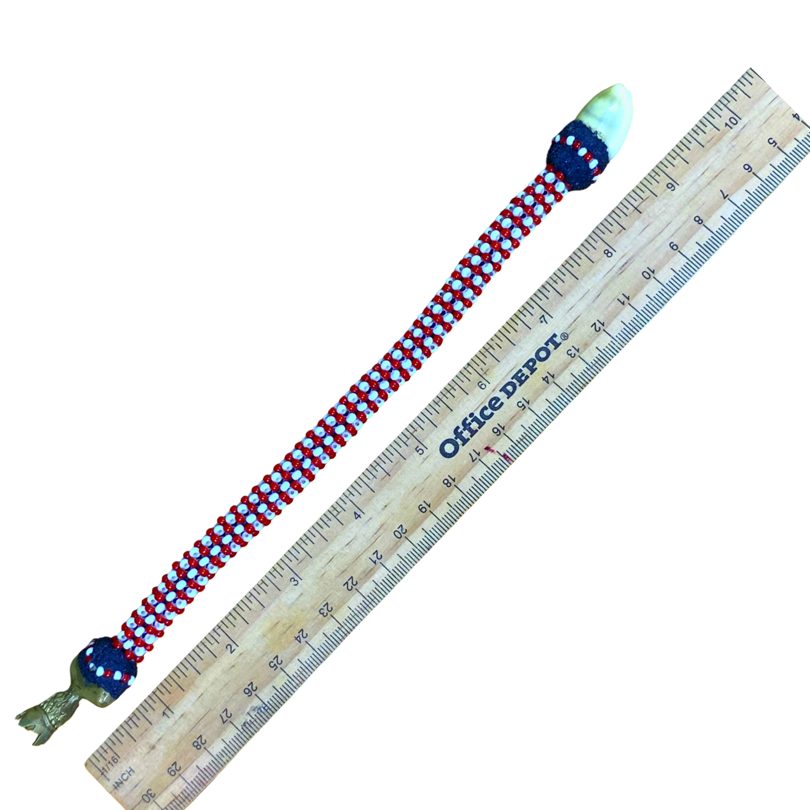 Side profile showing the Ilde de Shango, honoring the Orisha of thunder and justice.