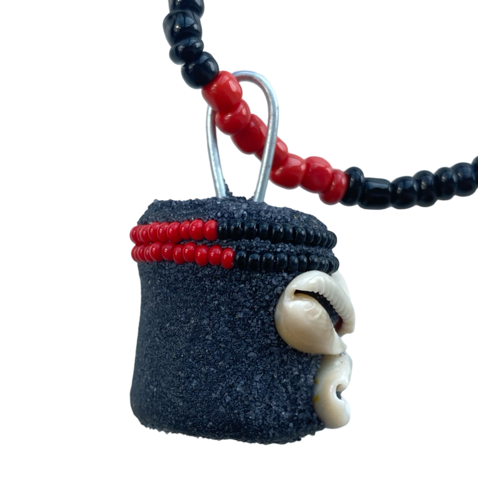 Side view showing the Eleguá Eleke necklace’s intricate hand-beading and pendant craftsmanship.