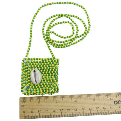 Detailed view of the Macuto and green and yellow crystal beads on the Eleke de Orúnmila necklace. - SanteriaGuide