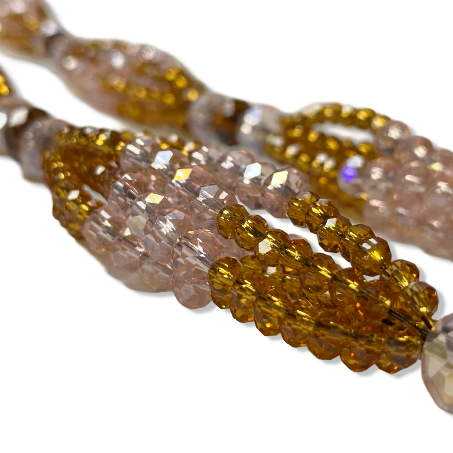 Side view showcasing the intricate craftsmanship of the pink, gold, and amber beads on the Obbá Mazo de Gala. - SanteriaGuide