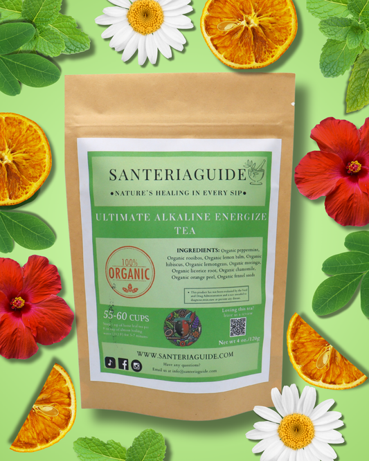 A brown paper package of "SanteriaGuide Ultimate Alkaline Energize Tea" is centered on a vibrant green background, surrounded by sliced oranges, hibiscus flowers, and daisies. The package proudly displays an ingredient list and a logo with the text "100% Organic." This alkaline tea blend from SanteriaGuide supports digestion and detoxification.