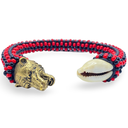 Eleguá Laroyé Eshu Ilde Bracelet crafted with authentic cowrie shells, black and red glass beads, and bronze accents. - SanteriaGuide