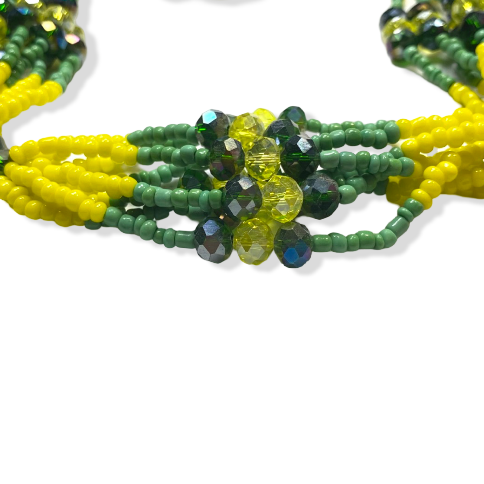 Side view highlighting the craftsmanship of the Mazo de Orunmila with green and yellow details.